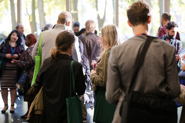 Fototapeta premium People talking in hall of auditorium