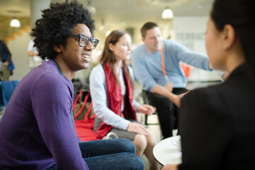 People talking in hall during conference break