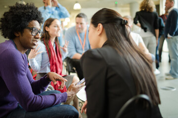 People talking in hall during conference break