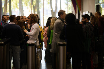 People leaving auditorium hallway