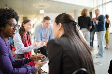 People talking in hall during conference break