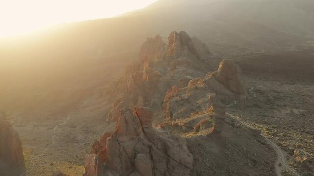 Volcanic nature landscape. Flying away from rocks by the Mount Teide.