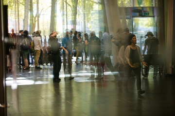 People talking in hall of auditorium