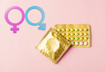World sexual health or Aids day, condom in wrapper pack and contraceptive pills blister hormonal...