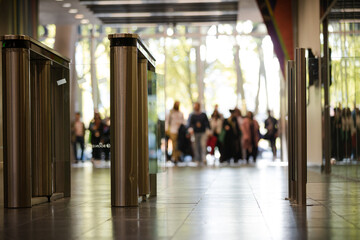 People entering auditorium hallway