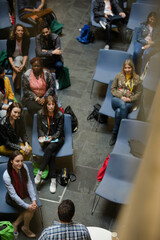 Conference audience watching speakers on stage