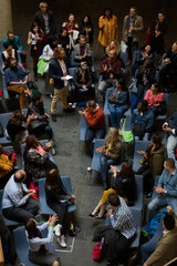 Conference audience watching speakers on stage