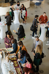 People talking in hall during conference break