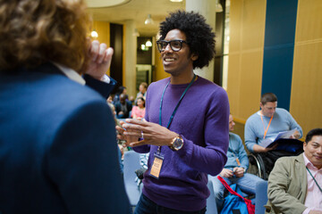 Men talking during conference break