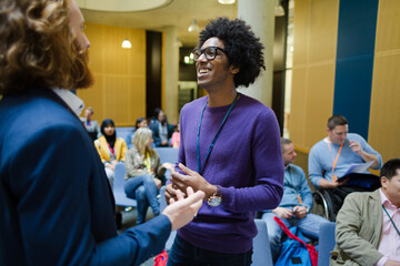 Men talking during conference break