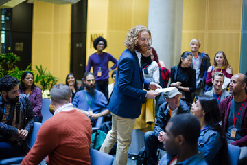 Conference audience watching speakers on stage