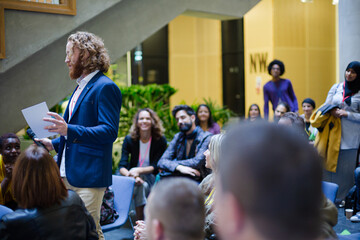 Audience watching speaker on stage