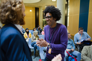 Men talking during conference break