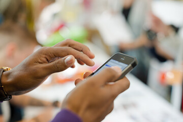 Man using phone in auditorium hall
