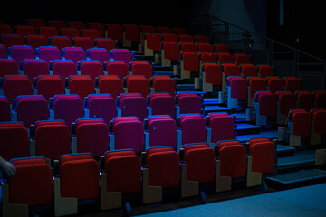 Red seats in empty auditorium