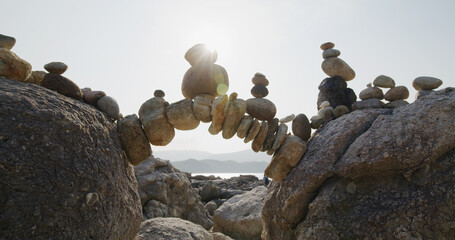 Arch of pebbles in balancing on the sea coast