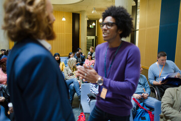 Men talking during conference break