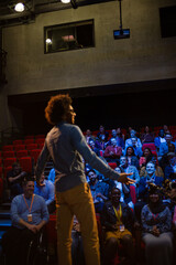 Obraz na płótnie Canvas Male speaker on stage talking to audience