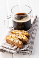 Italian cantuccini cookies and coffee cup. Sweet dried biscuits with almonds