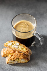 Italian cantuccini cookies and coffee cup. Sweet dried biscuits with almonds