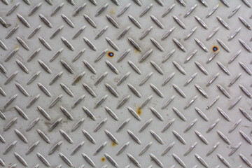 Silver painted metallic plate anti slip surface. Metal diamond plate texture.
