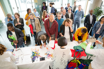 People signing up for conference