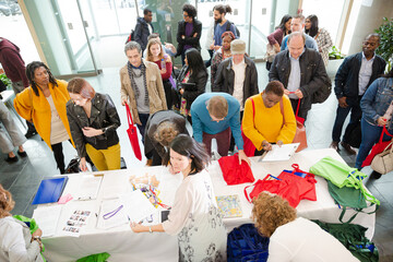 People signing up for conference
