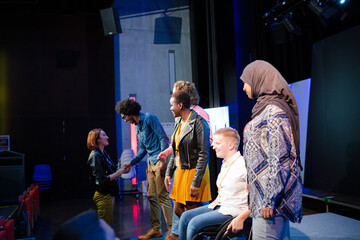 Speakers talking with audience