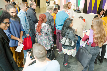 People signing up for conference