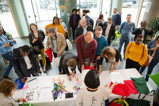 People signing up for conference