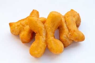 Deep-fried dough sticks or chinese bread sticks on white background.