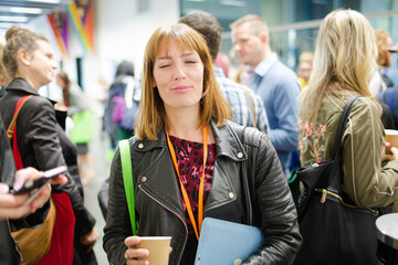 Smiling woman in conference audience