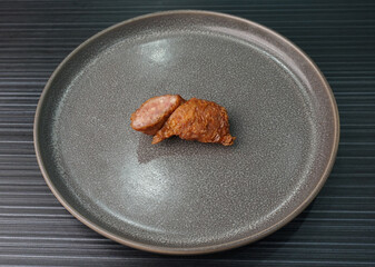 deep fried pork fish meat roll wrapped with bean curd skin ngohiang on dark grey wood background dim sum menu