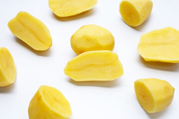 Raw peeled potatoes on white background