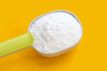 Baking soda on yellow background.