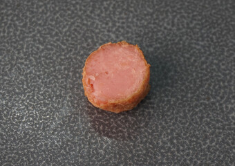 deep fried mini hot dog sausage luncheon meat with spicy sauce on dark grey wood background dim sum halal menu
