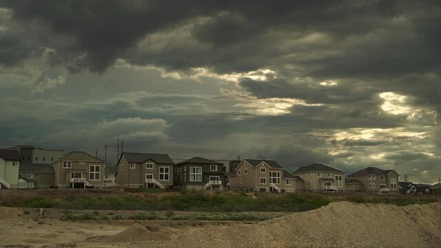 DRAMATIC TIMELAPSE OF CLOUDS MOVEMENT BEFORE STORM OVER HOUSES IN BLUFFDALE UTAH