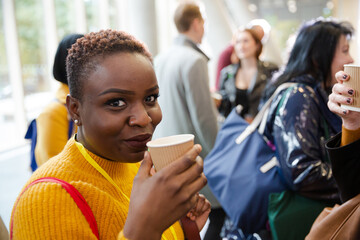 Women drinking coffee during conference break