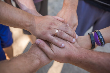 Solidarity unite people hands together community teamwork outdoor.