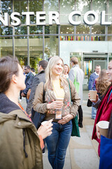 People talking outside auditorium