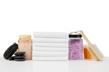 Spa still life with stacked of stone and towel isolated on white