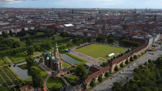 Beautiful cinematic aerial view of the  of the city of Copenhagen Denmark  the Rosenborg Castle and the Botanical Garden