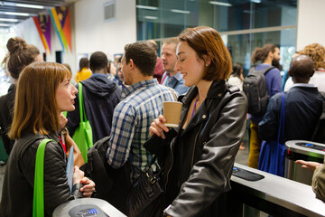 Smiling businesswomen in conference audience