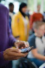 Man using smart phone during conference
