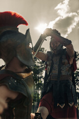 Battle with swords between two ancient warriors.