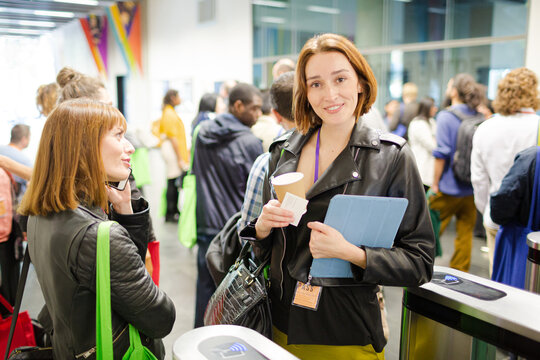 Smiling businesswomen in conference audience