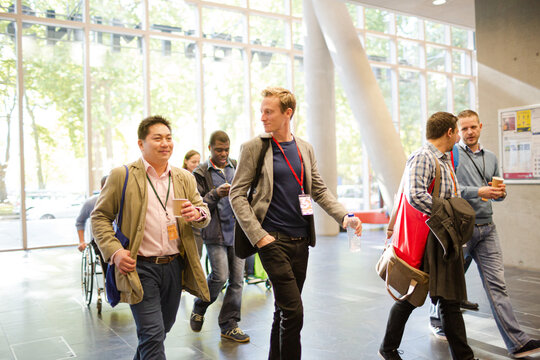 People entering auditorium hall