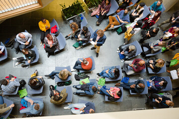 High angle view of people attending conference