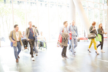 People entering auditorium hall