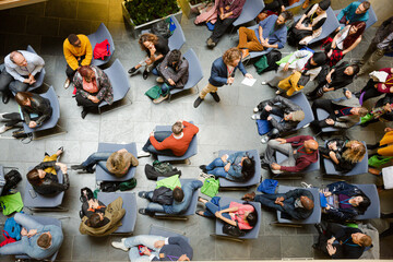 High angle view of people attending conference